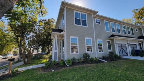 Front side view with 1 car garage & driveway