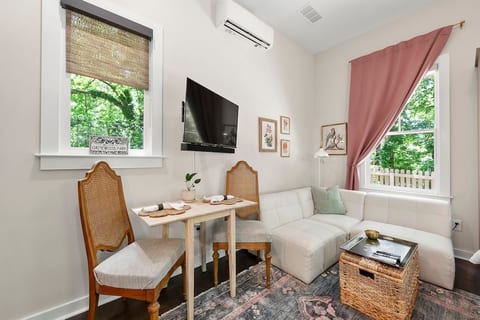 A wall-mounted mini-split HVAC unit keeps the temperature just right, controlled by remote. A ceiling fan adds extra airflow. Enjoy fast 400 Mbps download and 200 Mbps upload internet speeds. The 36" fold-out dining table doubles as a workspace.