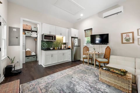 12' ceilings and five sizeable windows maximize natural light to create an open, airy feeling in 308 square feet of studio space.