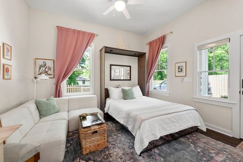 Experience luxurious comfort in our studio! The custom-built wall bed unfolds to reveal a plush 10" hybrid mattress, complete with built-in touch lighting & device charging. Drift off to sleep enveloped in 100% cotton linens.