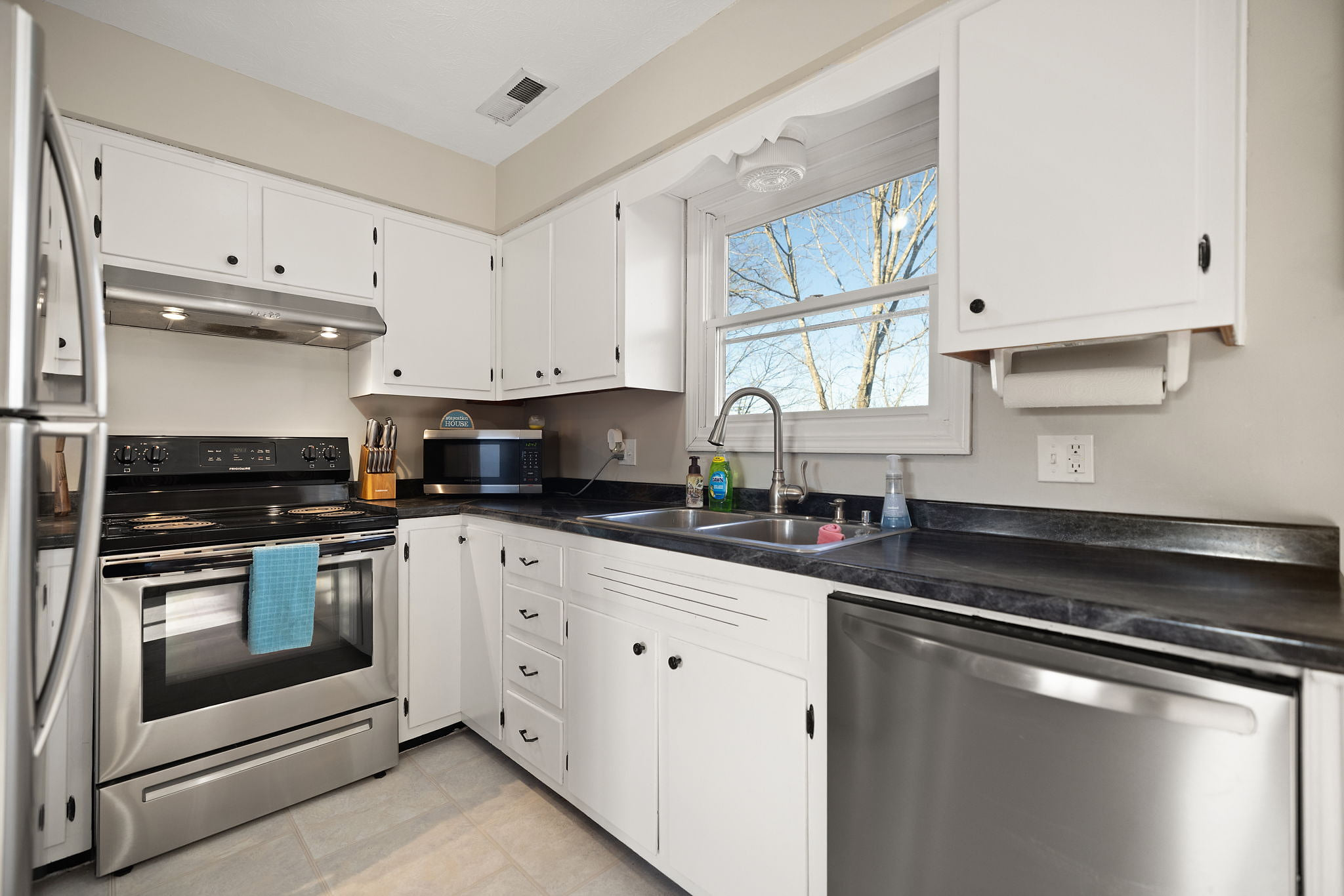 Bright kitchen with stainless appliances and ample counter space