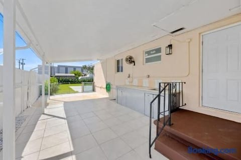 Covered patio with laundry, sink and counter