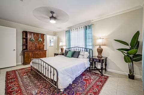 Primary bedroom with a king sized bed. Additional daybed is in this space. A full sized crib is found in the walk in closet for this bedroom.