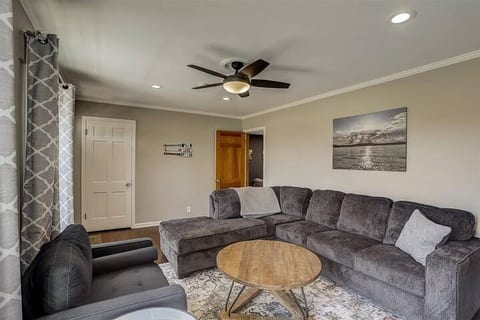 This is the front living room. It has a very comfortable sofa and a Smart TV
