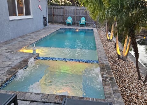 Tranquil View of Pool Deck & Canal from Inside & Outside