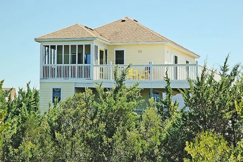 VIEW OF HOUSE FROM LAKE