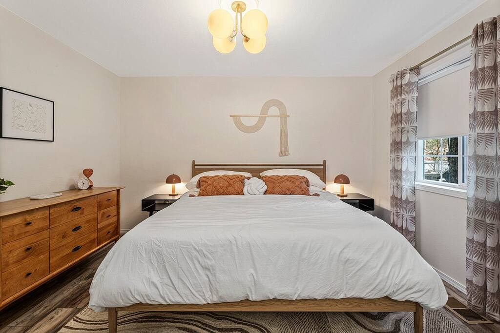 King size bed with Nectar Premier Hybrid Copper mattress, dresser, night stands with lamps, and USB-C chargers