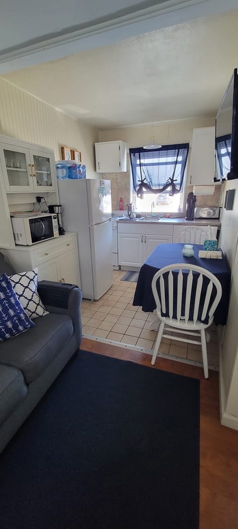 Full kitchen with TV that you can watch from couch or bed.