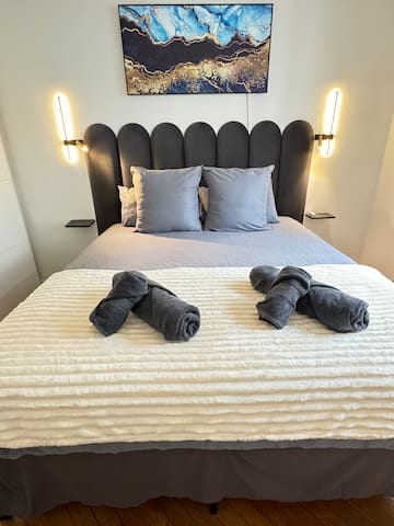 Guests appreciate the bedroom for its cozy atmosphere, along with the softness of the premium bedding and plush throw. A generous storage area provides ample space, allowing for an open, comfortable flow throughout the room.
