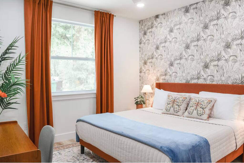 Bright Retreat: Vibrant decor and soft linens create a delightful escape in St. Augustine!