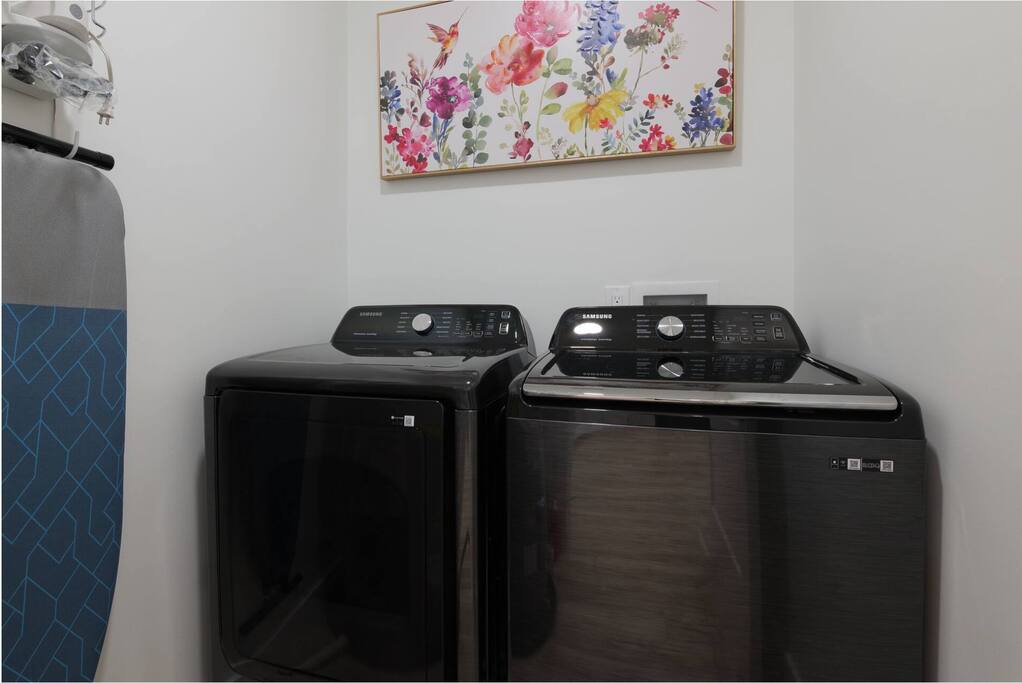 Laundry Room: Enjoy modern conveniences with stylish appliances and a touch of floral charm!