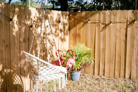 Serene Swing Under the Oaks
Nestled beneath centuries-old oaks draped in Spanish moss, this cozy swing invites you to relax, read, or simply sway with the breeze—a peaceful backyard nook made for slow moments and lasting memories.