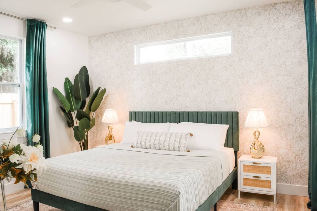 Vibrant decor, plush bedding, and tropical vibes for your perfect escape!