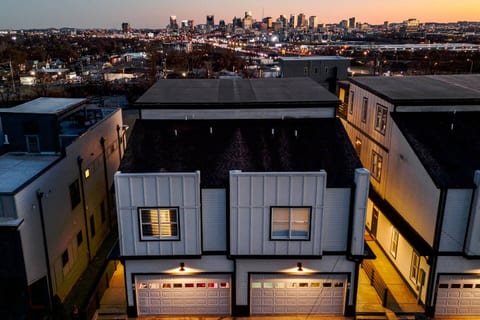 Exterior | Duplex Homes | Skyline View | Front Entry
Welcome to your Nashville home base—two modern side-by-side duplexes with garages, glowing lights, and stunning downtown skyline views just minutes from Broadway.