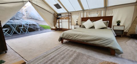 Queen size bed with lots of pillows!