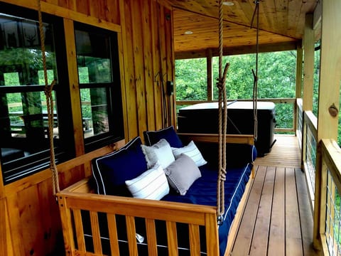 The First of its kind at Red River Gorge! Take an afternoon nap on the covered porch swing. Raining...no problem, even more relaxing.