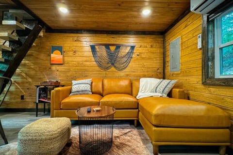 Luxury leather couch is the highlight of this cozy living space