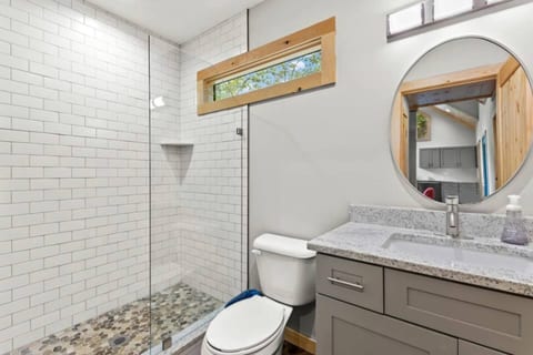 Modern, clean lines found in the full bath.
