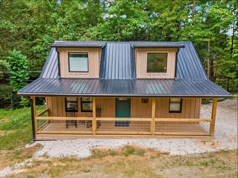 Front view of cabin with cozy covered front porch