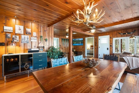 The dining area is in an open concept layout. Live edge wood table big enough to accommodate all your guests.