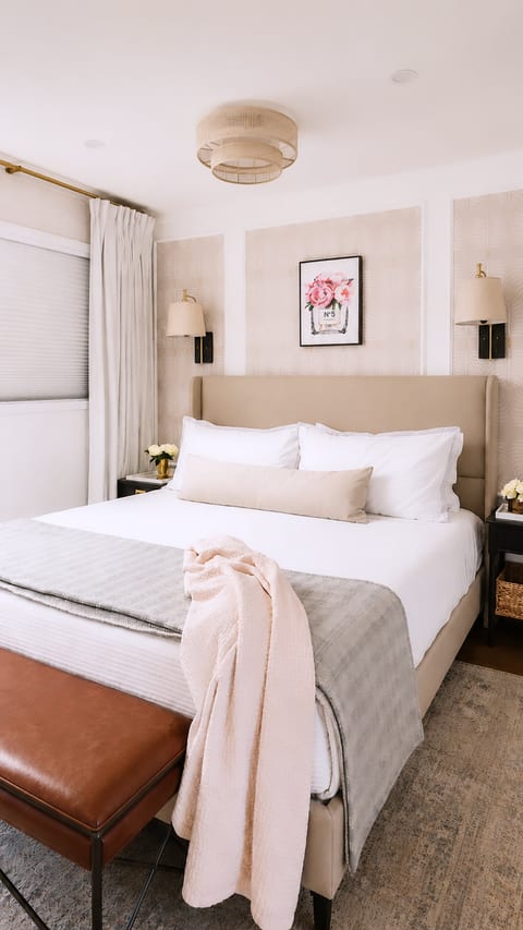 Serene king bedroom with luxe linens, soft lighting, and elegant decor