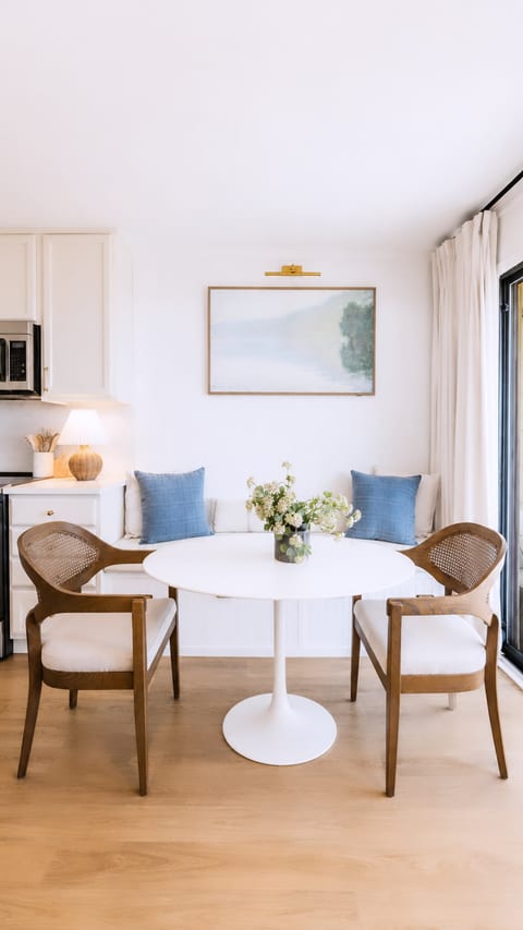 Sunny dining nook with stylish seating and a bright, airy feel