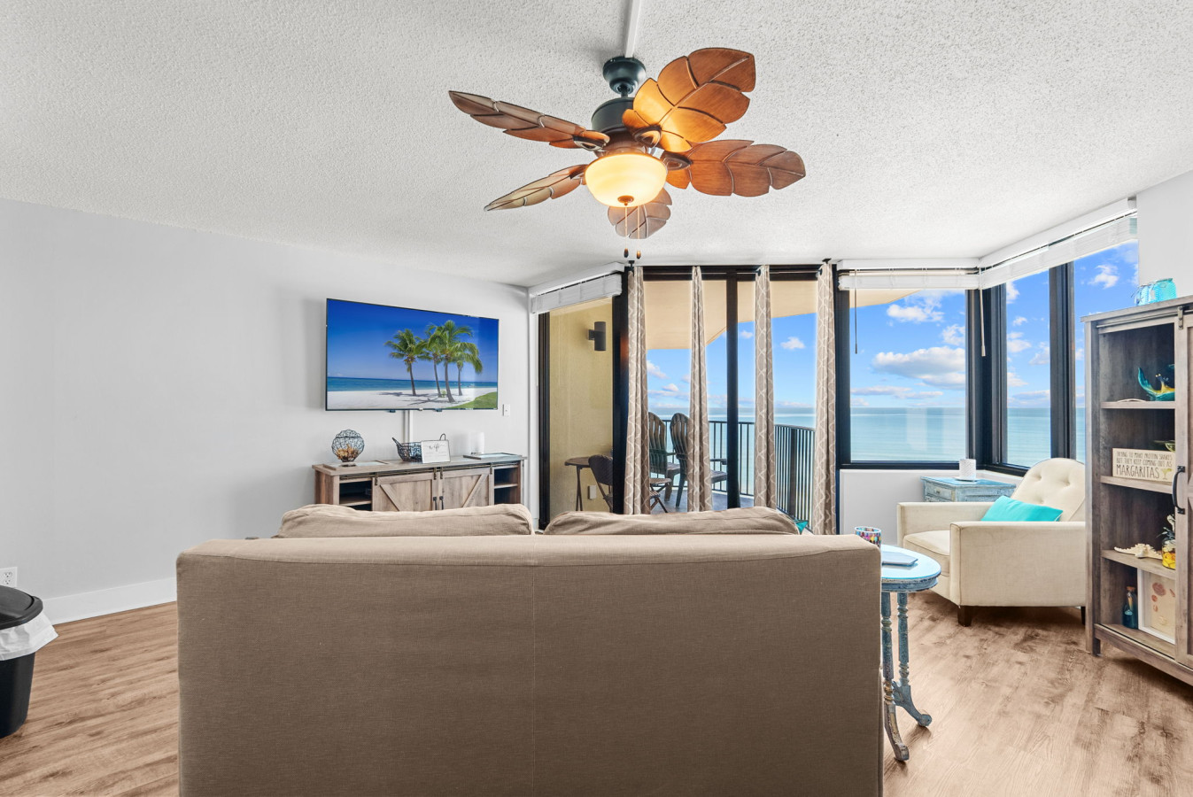 ick back in the cozy living room with a tropical ceiling fan, Smart TV, and breathtaking views of the Gulf right outside your balcony doors.