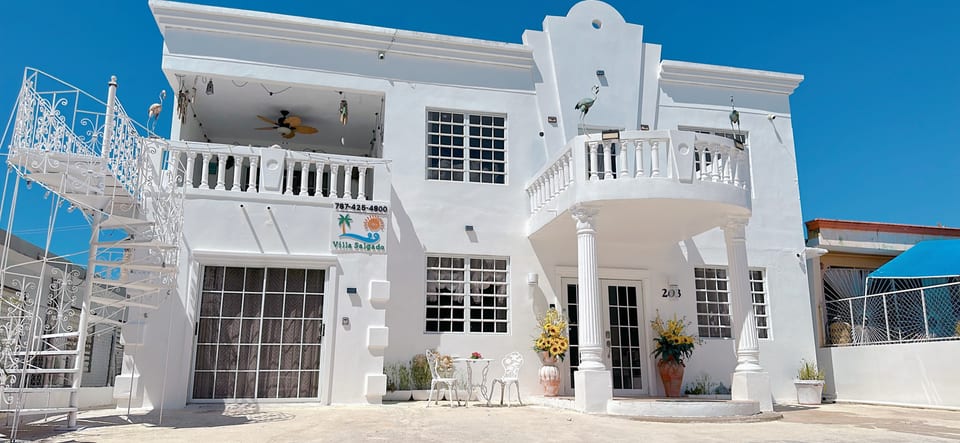 Exterior Oasis: Revel in the stunning architecture and sunlit terrace of Villa Salgado!