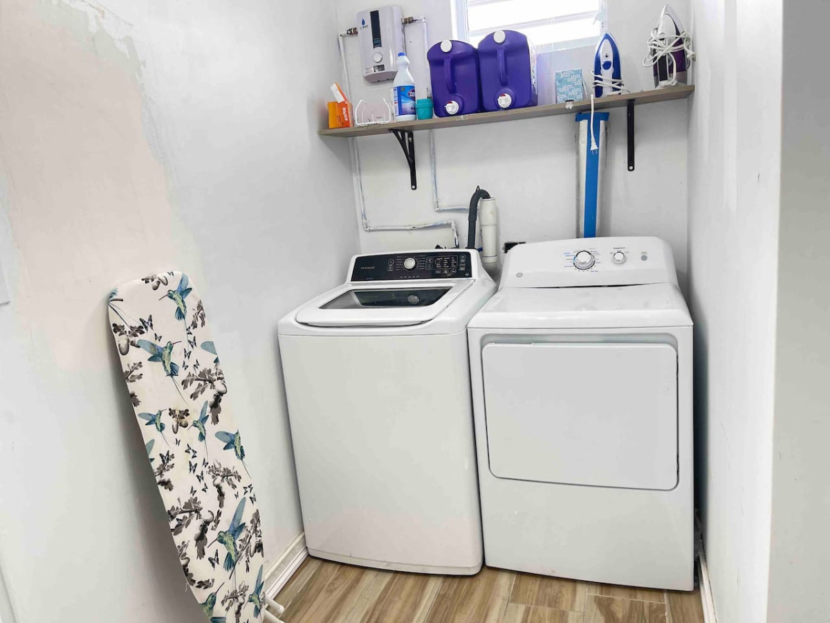 Laundry Room: Efficient space equipped with modern appliances for hassle-free laundry days!