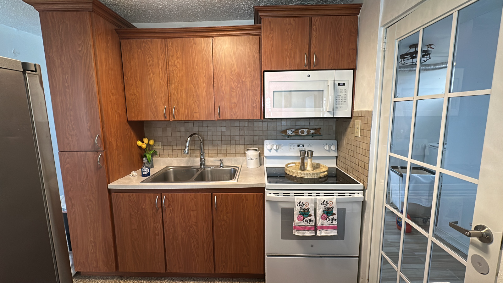 Kitchen: Whip up delicious meals in this stylish space with modern appliances and bright accents!