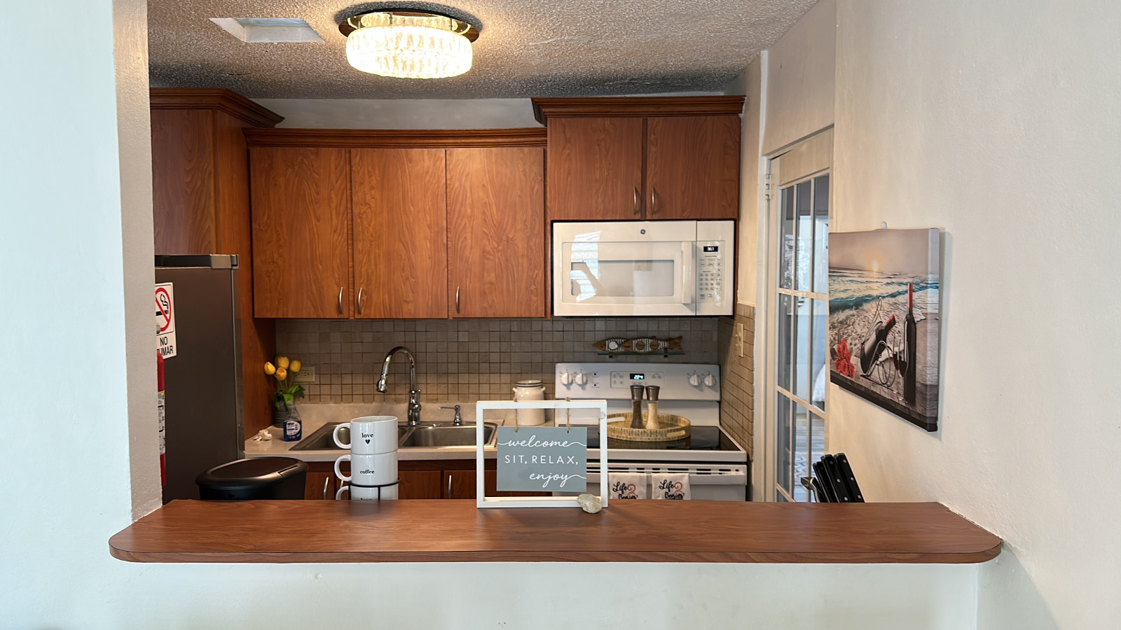 Kitchen Corner: Bright space with modern appliances and island seating for casual meals!
