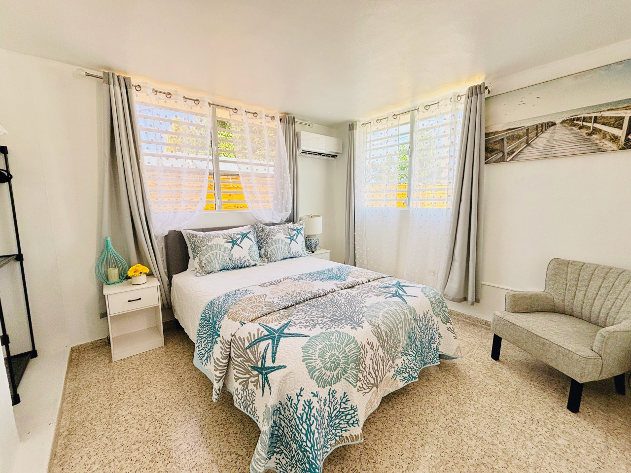 Serene Bedroom: Stylish decor and charming details invite you to unwind in paradise!