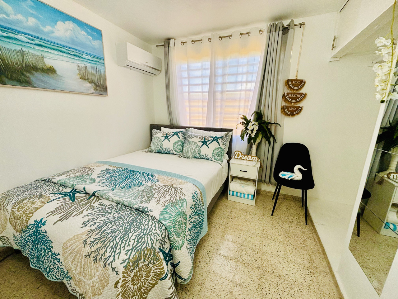 Second Bedroom: Beachy vibes with stunning decor, bright light, and refreshing ocean air!