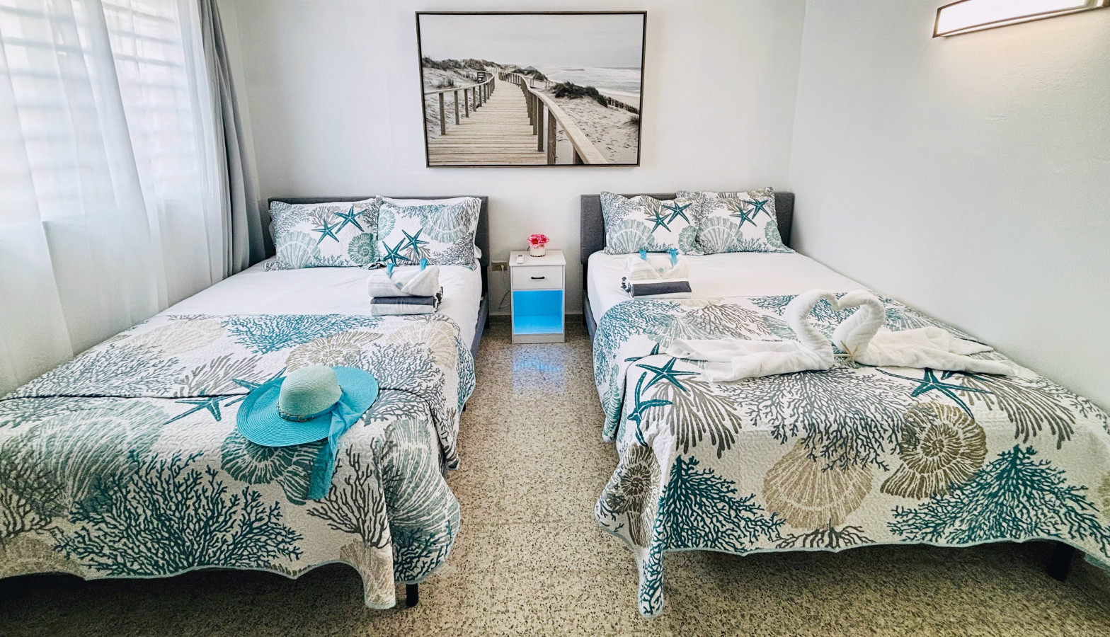 4th Bedroom: Bright and beachy retreat with two queen beds and ocean-inspired decor!