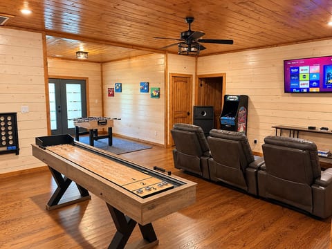 Rustic Game Room with Shuffleboard, Foosball, and Arcade
