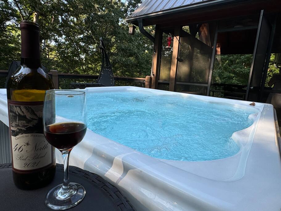 Relax in nature on our elevated deck featuring a 4-person hot tub, gas grill, chaise chair swing, and stunning views. Ambient lighting sets the perfect atmosphere for unforgettable nights under the stars. Relax in nature on our elevated deck featuring a 4-person hot tub, gas grill, chaise chair swing, and stunning views. Ambient lighting sets the perfect atmosphere for unforgettable nights under the stars. - Spacious Cabin, Hot Tub, Theater, Dog Run, FirePit - Ellijay
