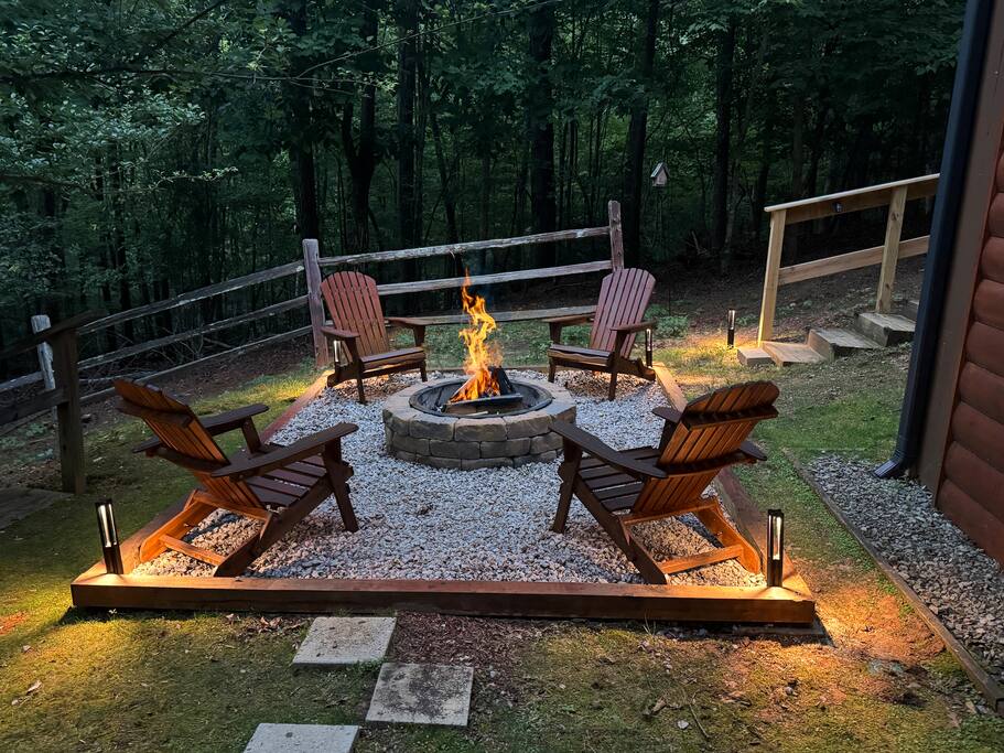 Cozy up by the firepit, surrounded by the beauty of nature. Perfect for s'mores, stories, and stargazing, this serene backyard retreat invites you to unwind and create unforgettable memories in the great outdoors. Cozy up by the firepit, surrounded by the beauty of nature. Perfect for s'mores, stories, and stargazing, this serene backyard retreat invites you to unwind and create unforgettable memories in the great outdoors. - Spacious Cabin, Hot Tub, Theater, Dog Run, FirePit - Ellijay