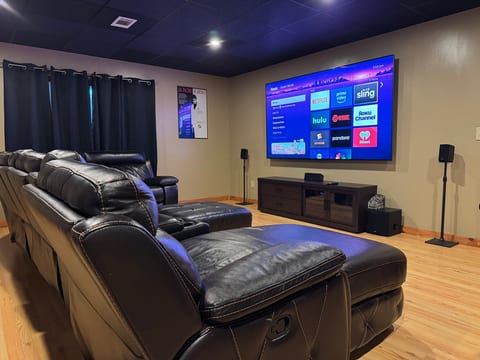 Private home theater with recliners, big-screen TV, and surround sound