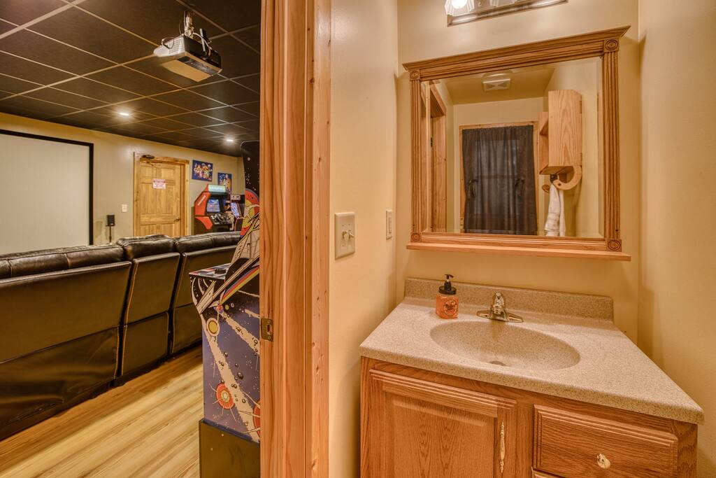 Half bath adjacent to the Home Theater / Game Room Half bath adjacent to the Home Theater / Game Room - Spacious Cabin, Hot Tub, Theater, Dog Run, FirePit - Ellijay