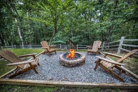 Private woodland firepit with Adirondack chairs for stargazing nights