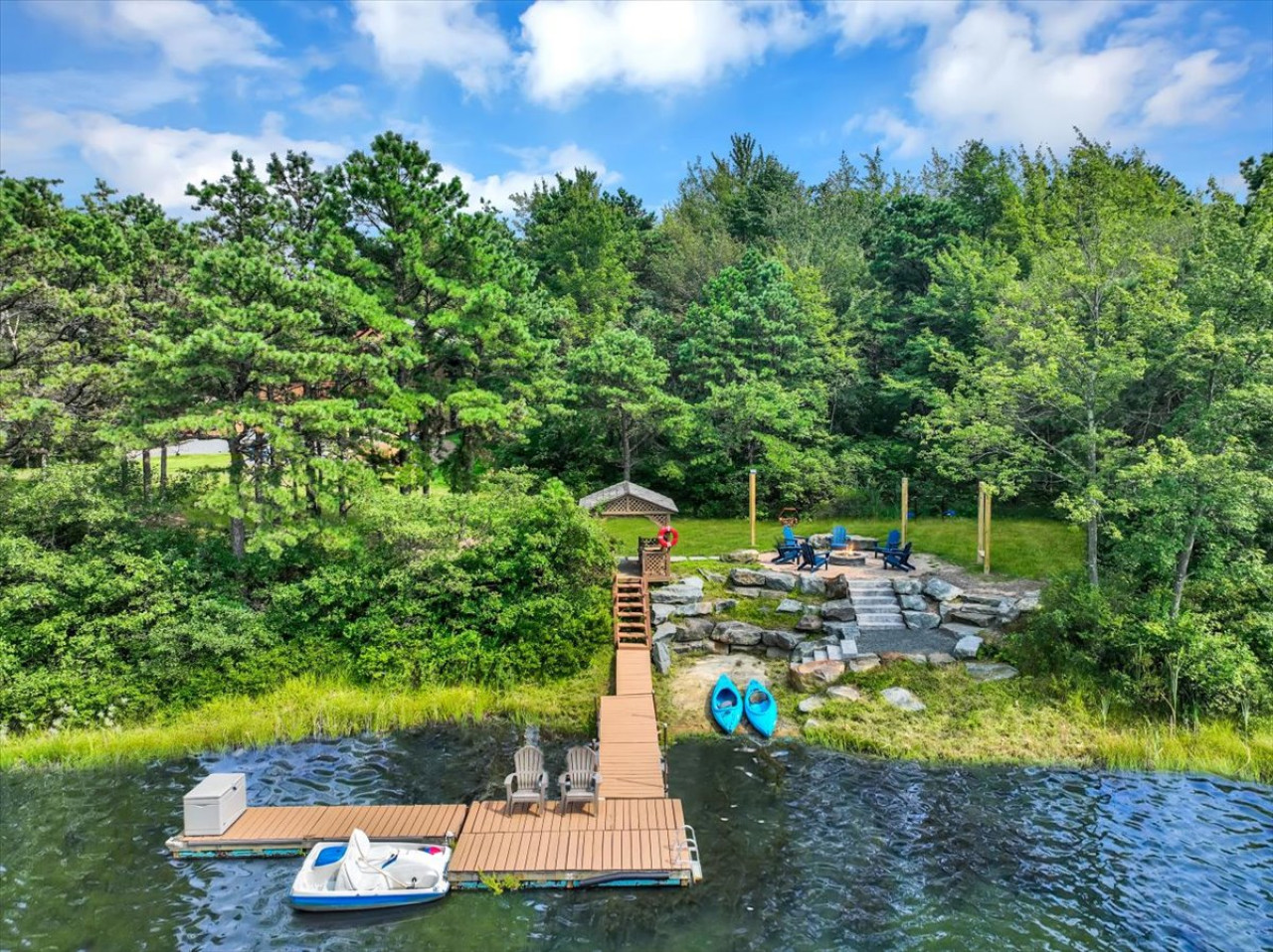 Step off your private dock and straight into adventure—kayaks and a paddle boat are ready for you to explore the lake.