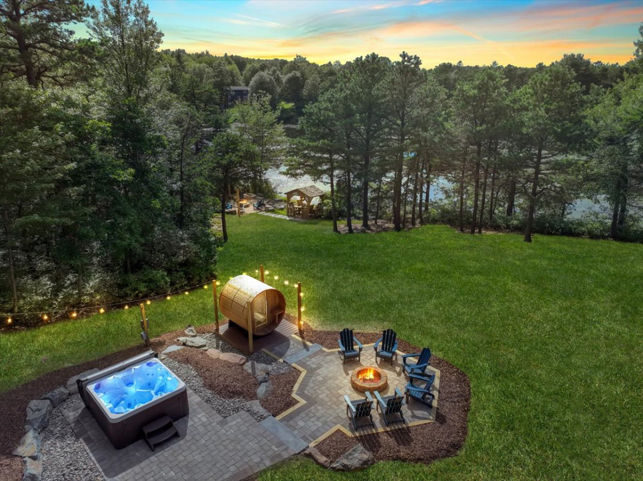 Your private backyard haven—unwind in the hot tub, relax in the sauna, gather around the firepit, or step straight into the lake from your own serene retreat.