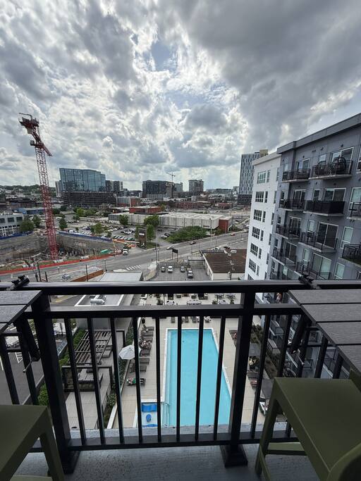 Balcony | Pool + Cityscape View | Upper Floor
Take in sweeping views of the skyline and pool deck from your private balcony—perfect for sipping morning coffee or watching the Nashville lights come alive at night.