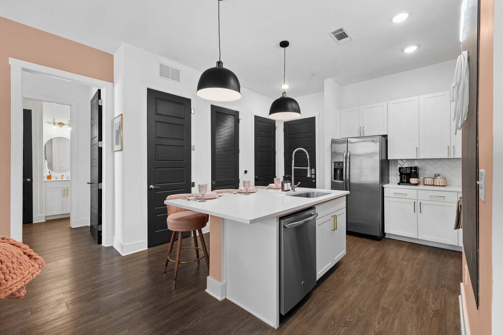 Kitchen with spacious island for preparing meals, dining in, or gathering.