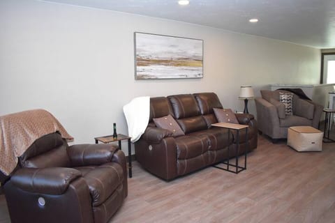 Living room with comfortable seating and smart ROKU TV.