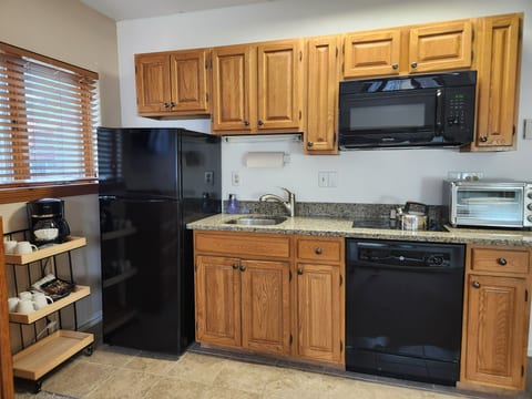 In the main room of the condo there is a kitchenette with fridge, cooktop, microwave and toaster/air fryer, coffee maker, blender and dishwasher. We have dishes, cups & utensils for adults and kids. Pots, wine glasses and basic spices included too!