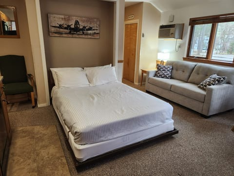 A queen murphy bed is located in the main room. It can be put down for sleeping at night or put away during the day to allow more space in the room. We also provide family games, blocks and books for our younger guests.