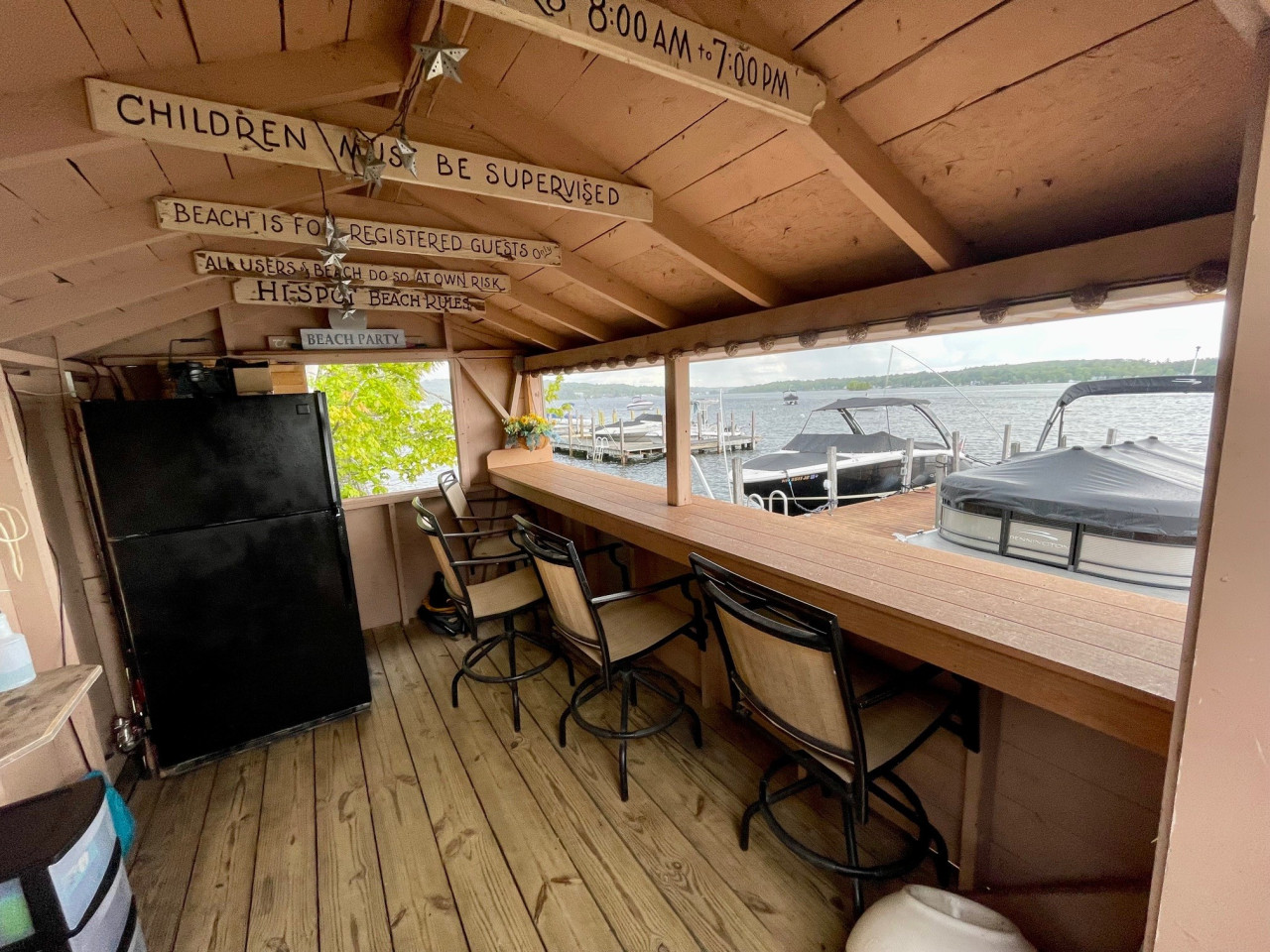 Inside the Tiki Hut complete with a full size fridge & some bar stools Inside the Tiki Hut complete with a full size fridge & some bar stools - Winnipesaukee Lakefront w/ Private Dock, Beach, Kayaks - Laconia