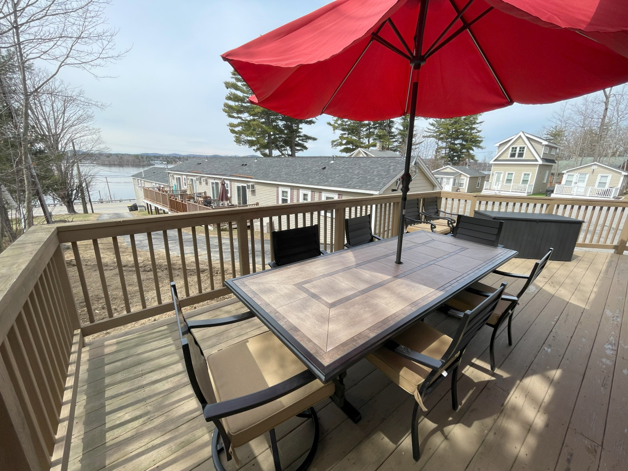 Lower Level Deck with Large Dining Table Lower Level Deck with Large Dining Table - Winnipesaukee Lakefront w/ Private Dock, Beach, Kayaks - Laconia