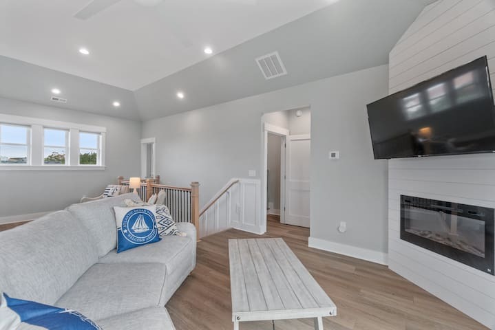 Living area and steps leading to 2nd floor